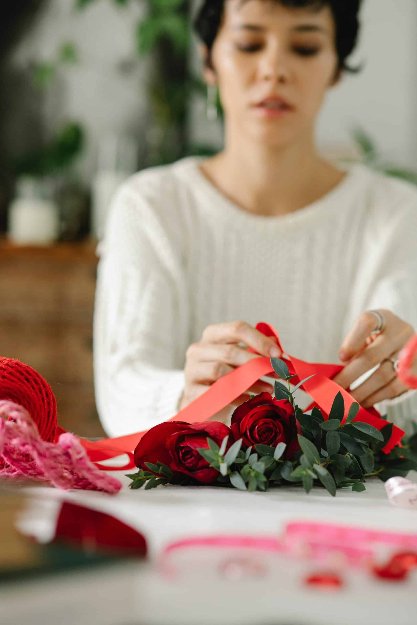 Event Vendor Photo by Michelle Leman: https://www.pexels.com/photo/young-ethnic-female-florist-tying-bow-on-bunch-of-red-roses-6765765/