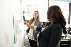 Photo by Christina Morillo: https://www.pexels.com/photo/two-women-in-front-of-dry-erase-board-1181533/ -- corporate events