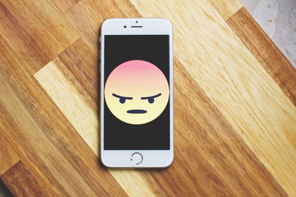 Photo by freestocks.org: https://www.pexels.com/photo/silver-iphone-6-987585/ -- unhappy