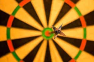 Photo by Skitterphoto: https://www.pexels.com/photo/black-dart-pink-attach-on-yellow-green-and-red-dart-board-15812/ -- goals, bullseye