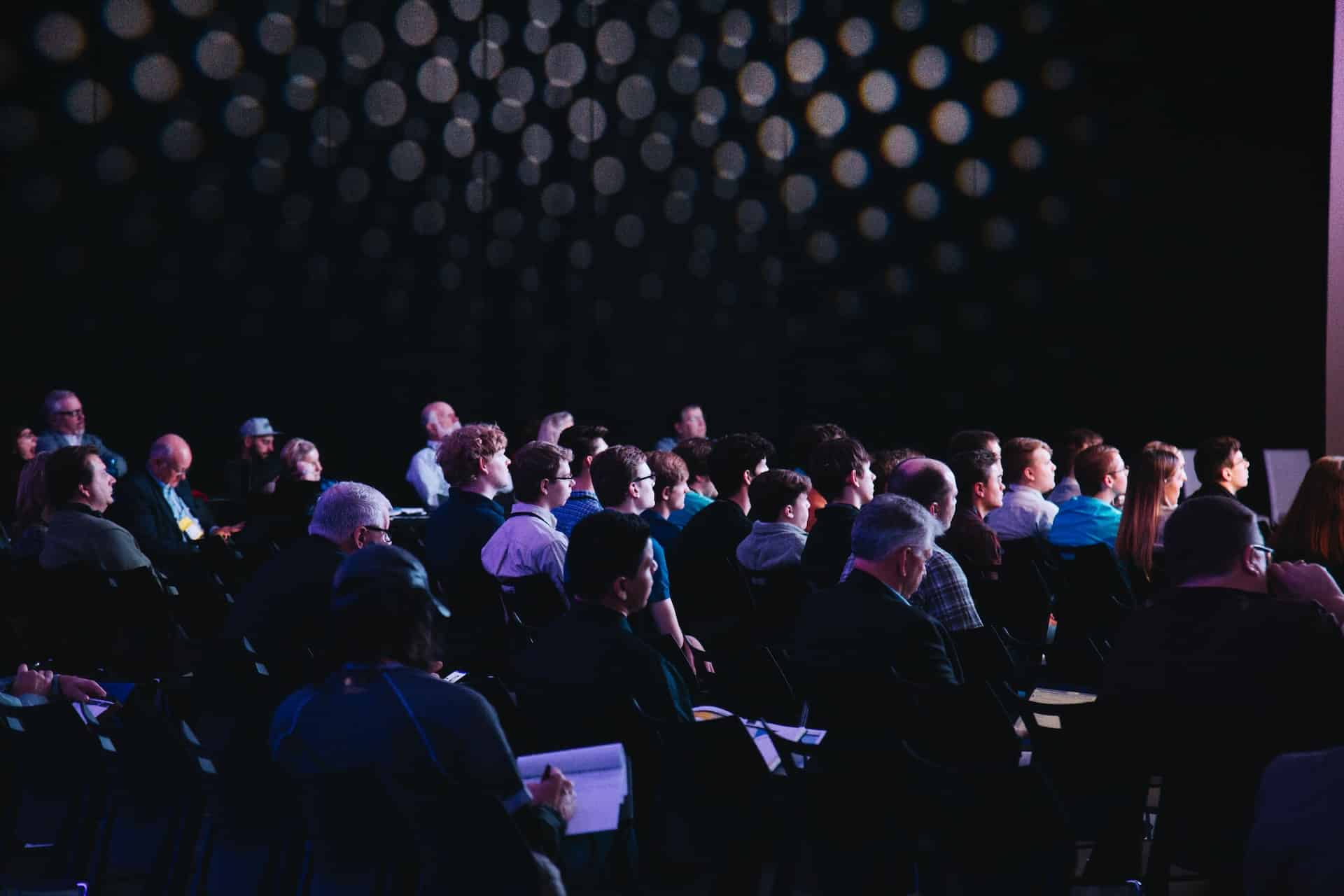 Image Title: Austin Event Trends Conference Audience Image Description: Attendees focused on a presentation at an Austin event trends conference Alt Text: Attentive Audience Source: https://unsplash.com/photos/crowd-of-people-sitting-on-chairs-inside-room-F2KRf_QfCqw