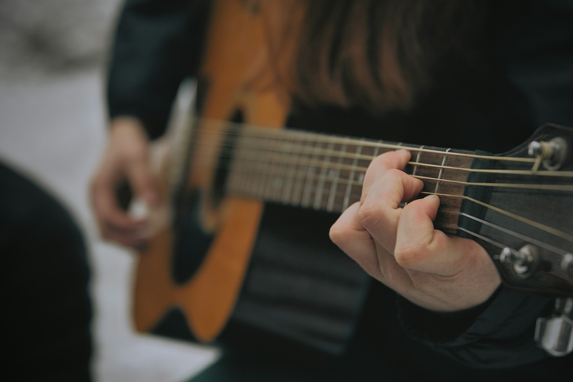 https://unsplash.com/photos/someone-is-playing-a-brown-acoustic-guitar-vom-EwMvcf4 Photo by Everett Pachmann on Unsplash