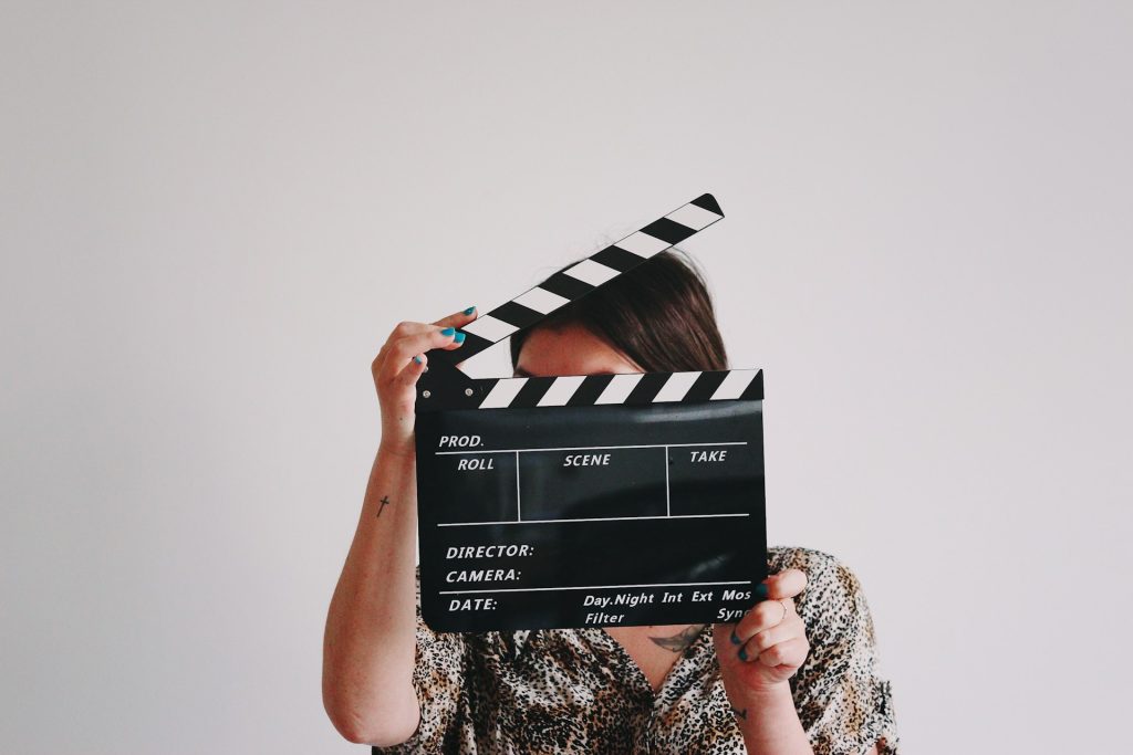 https://unsplash.com/photos/a-woman-holding-a-clapper-over-her-face-A-obUh61bKw Photo by Jon Tyson on Unsplash