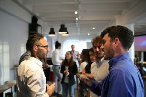 Photo by M ACCELERATOR on Unsplash https://unsplash.com/photos/a-group-of-people-standing-in-a-room-yTsy3PYFPtc