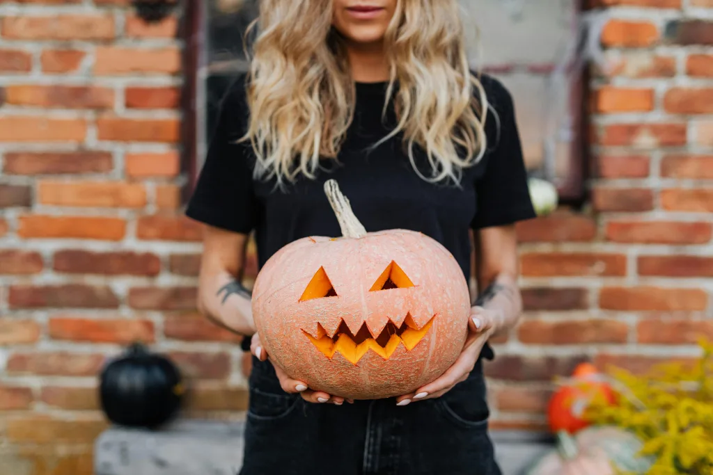 https://www.pexels.com/photo/woman-holding-a-carved-pumpkin-for-halloween-decoration-5422736/ Photo by Kaboompics.com on Pexels