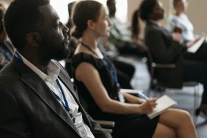 https://www.pexels.com/photo/a-man-attending-a-business-seminar-8761525/