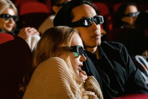 Photo by Tima Miroshnichenko: https://www.pexels.com/photo/a-couple-sitting-in-a-movie-theater-7991529/