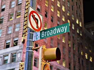 https://unsplash.com/photos/a-traffic-light-and-street-sign-in-front-of-a-large-building-Fb_ERqcf2vw Photo by Chels Lin on Unsplash