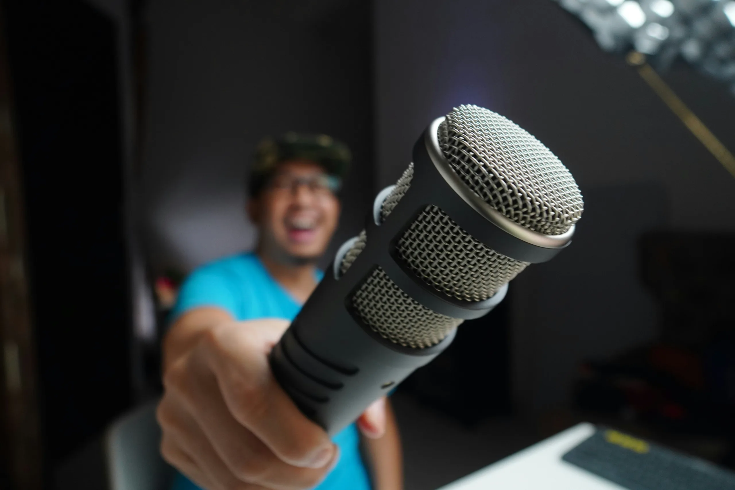 https://unsplash.com/photos/man-in-blue-and-black-crew-neck-t-shirt-holding-microphone-92gUiR6UhVg Photo by Medy Siregar on Unsplash