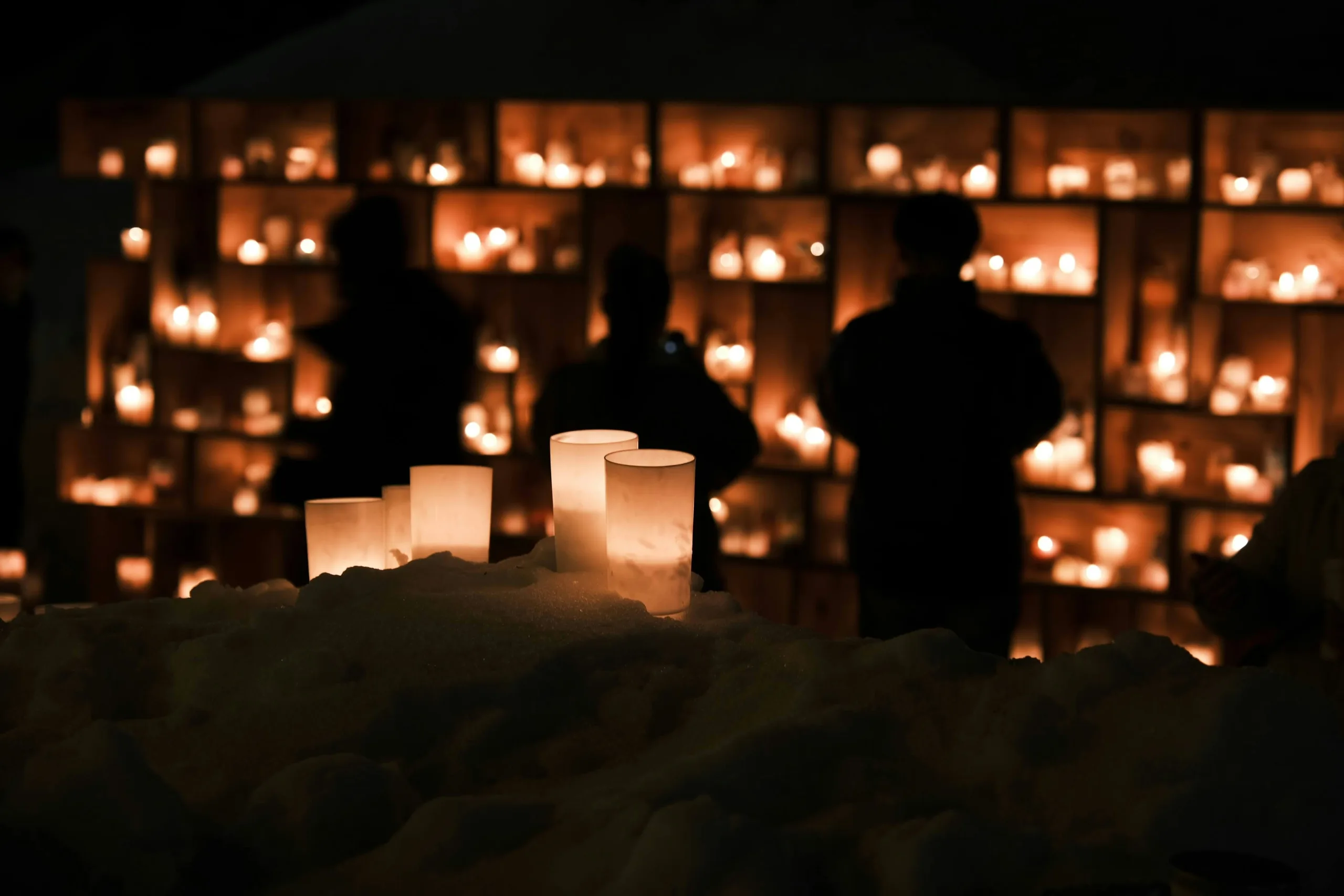https://unsplash.com/photos/a-group-of-people-standing-in-front-of-a-wall-of-candles-Ofv7JFZZXw8 Photo by Seiya Maeda on Unsplash