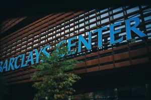https://unsplash.com/photos/a-building-with-a-sign-that-says-barclays-center-vQq-NTV-f4k Photo by Matthew LeJune on Unsplash