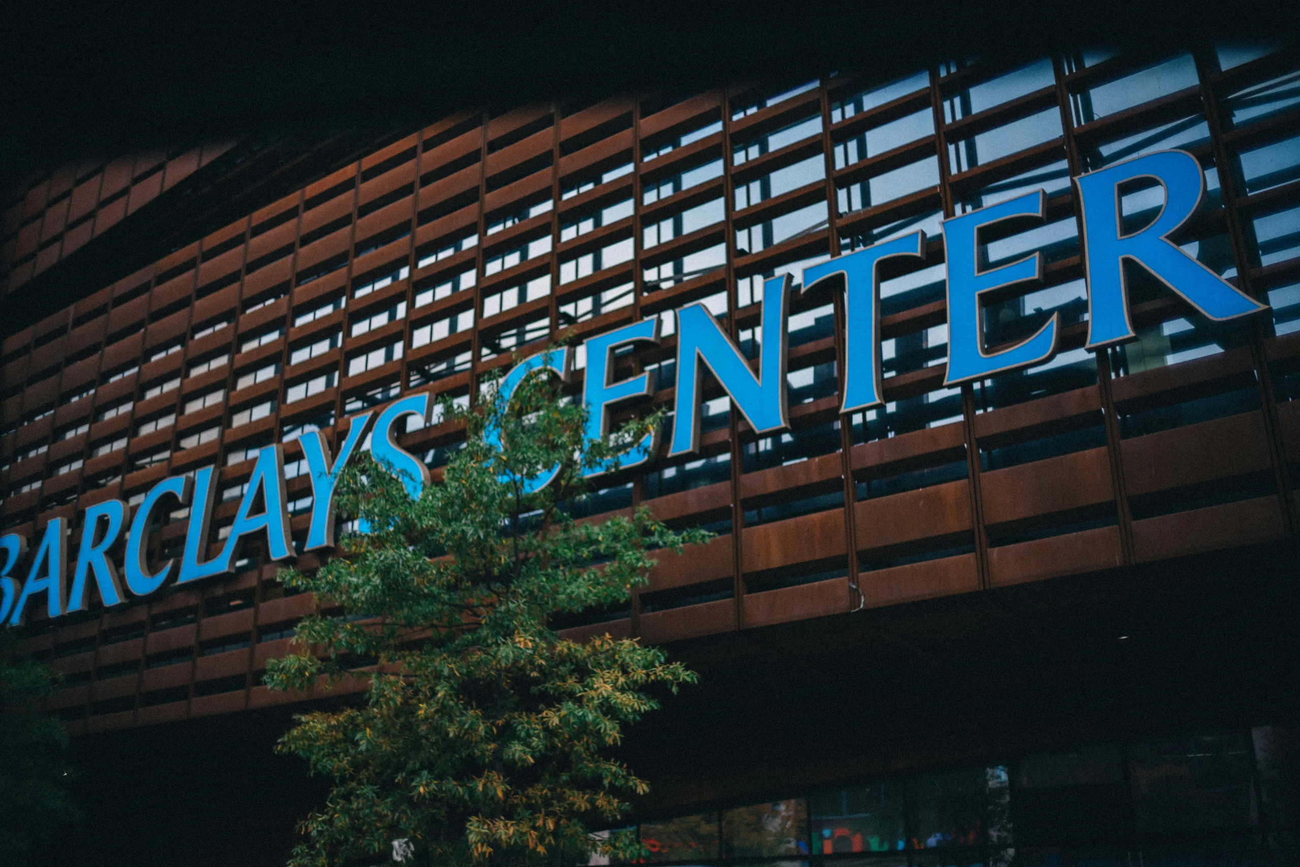 https://unsplash.com/photos/a-building-with-a-sign-that-says-barclays-center-vQq-NTV-f4k Photo by Matthew LeJune on Unsplash