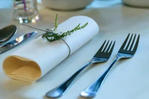 https://www.pexels.com/photo/stainless-steel-fork-beside-rolled-paper-towel-with-parsley-on-top-172491/ Photo by AS Photography on Pexels