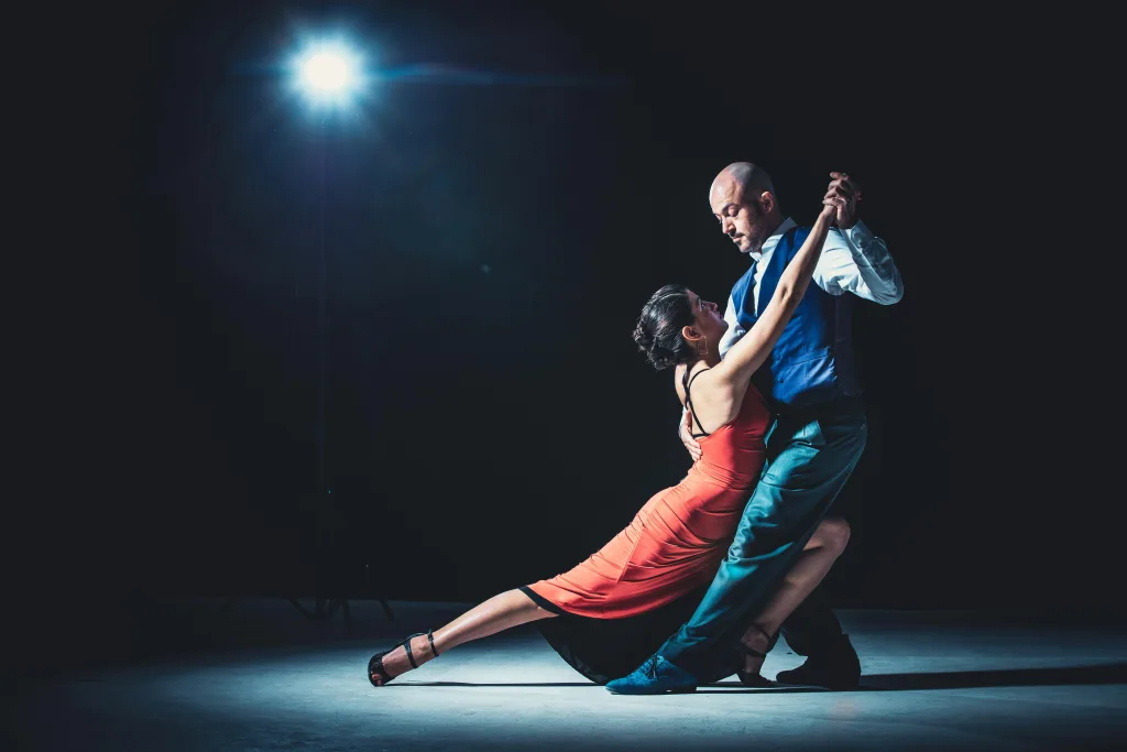 https://www.pexels.com/photo/woman-and-man-dancing-under-light-2188012/ Photo by Marko Zirdum