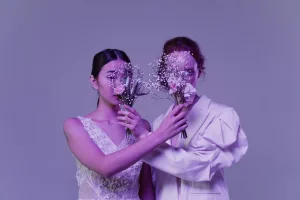 https://www.pexels.com/photo/two-women-hiding-their-face-with-bouquet-of-flowers-7300663/