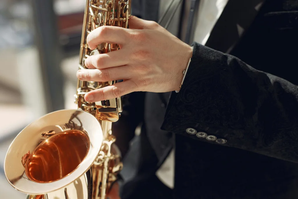 https://www.pexels.com/photo/person-holding-brass-saxophone-3984803/ Photo by Gustavo Fring on Pexels
