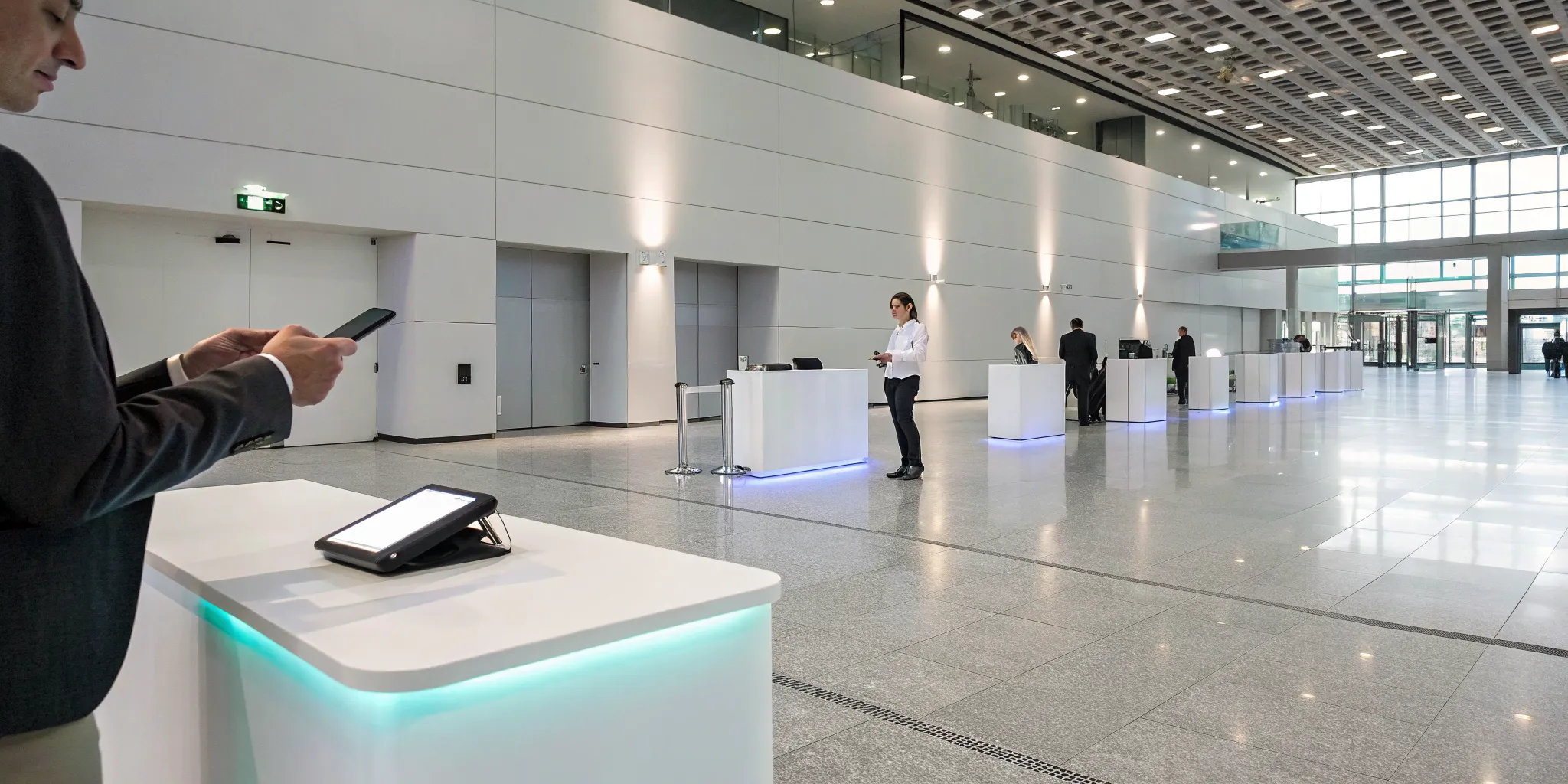 An exhibitor completes registration at an event tech trade show using a digital kiosk.