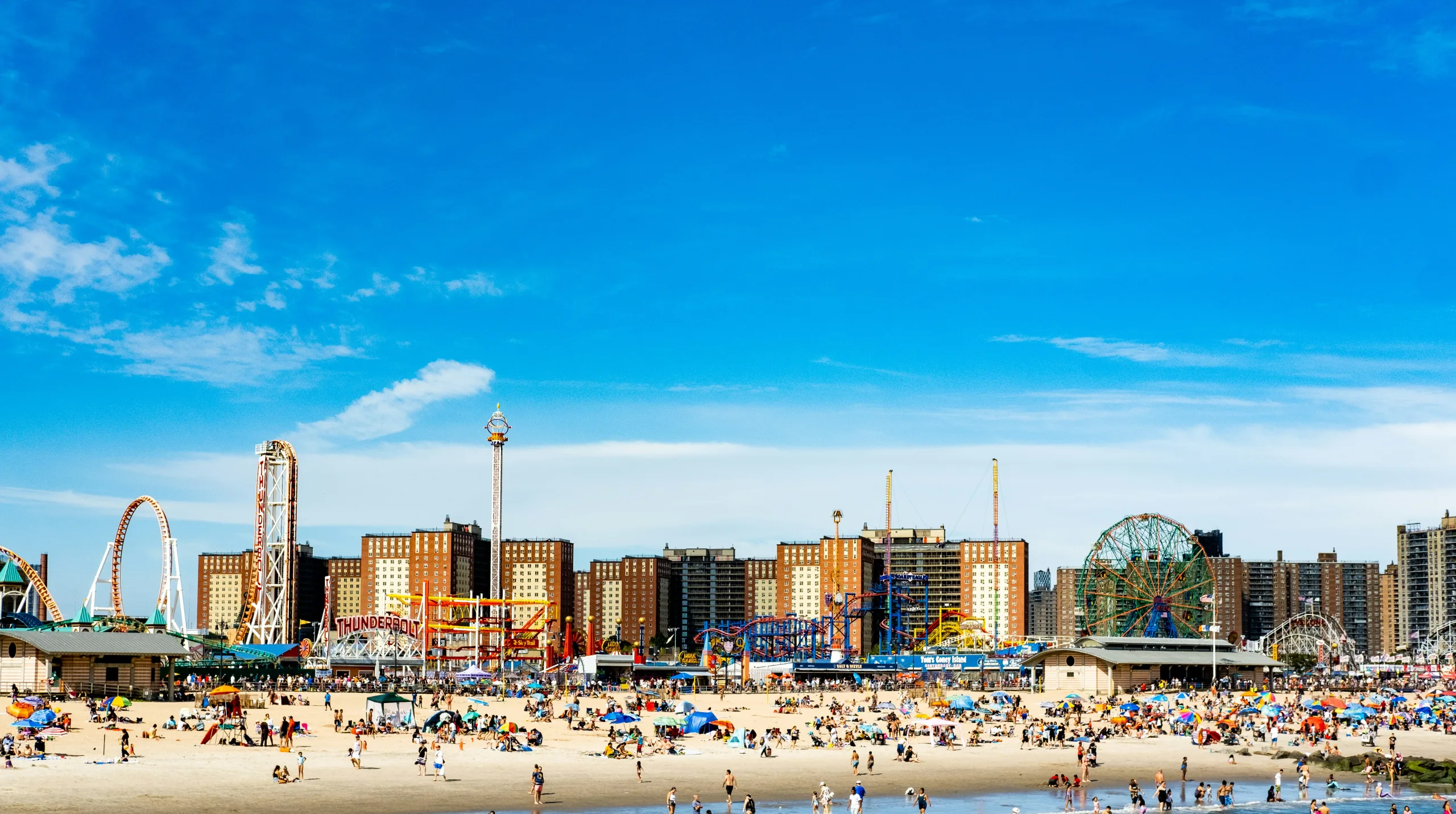 https://unsplash.com/photos/a-beach-with-a-ferris-wheel-in-the-background-4r2CamyvyJc Photo by Dana Andreea Gheorghe on Unsplash