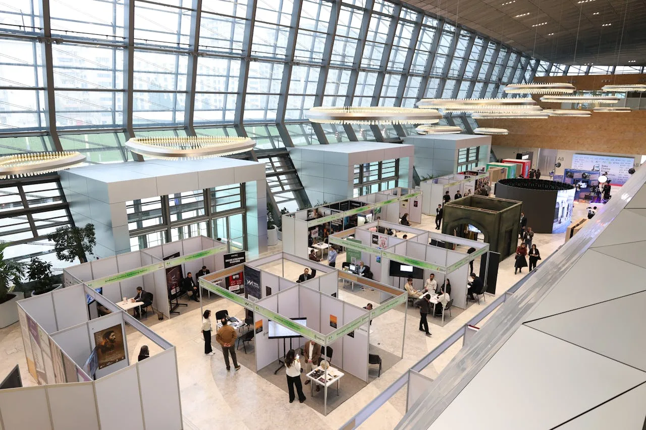 Trade show floor with exhibitor booths at a conference event