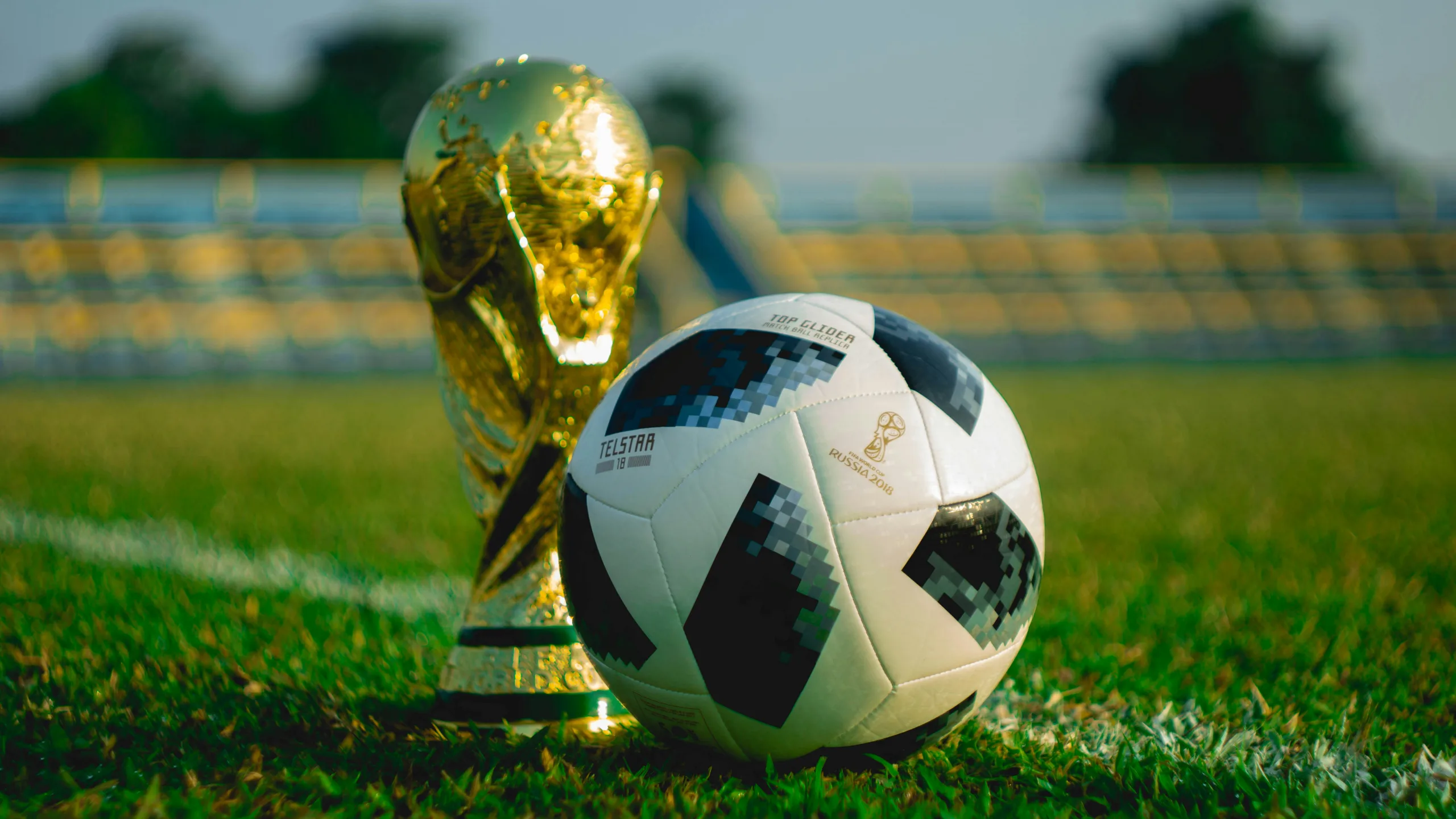 https://unsplash.com/photos/soccer-ball-beside-trophy-on-soccer-field-crn276hbbYU Photo by Fauzan Saari on Unsplash