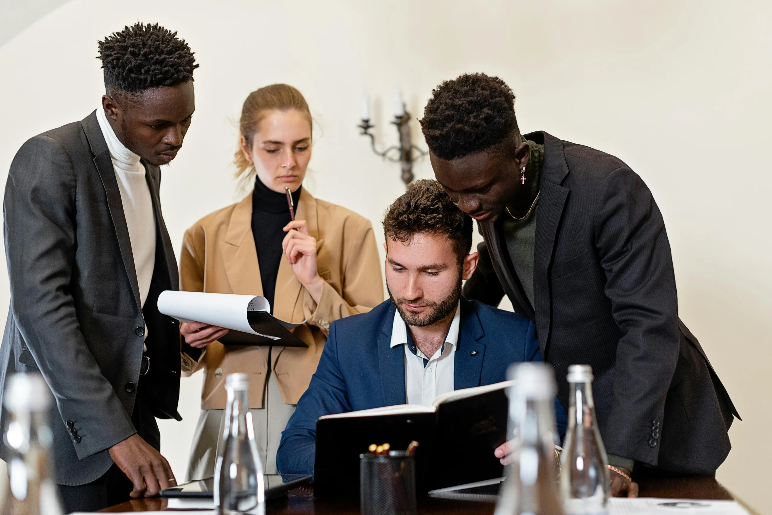 Photo by Mikhail Nilov: https://www.pexels.com/photo/a-group-of-people-having-a-meeting-8730134/