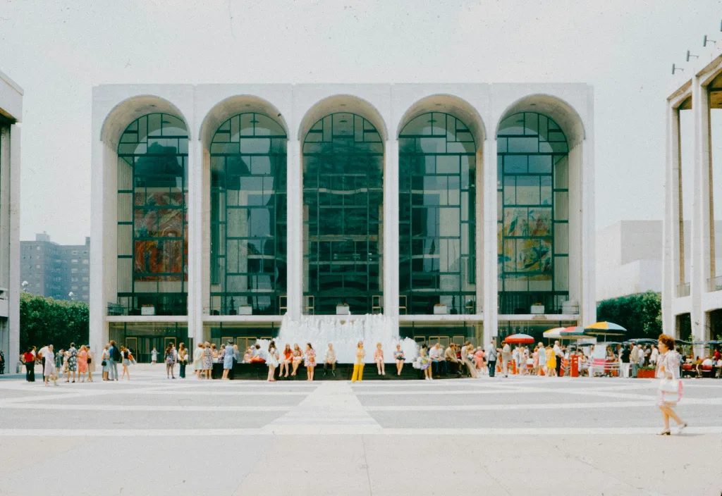https://unsplash.com/photos/a-group-of-people-standing-in-front-of-a-building-6mCEAqZgVFE Photo by Annie Spratt on Unsplash