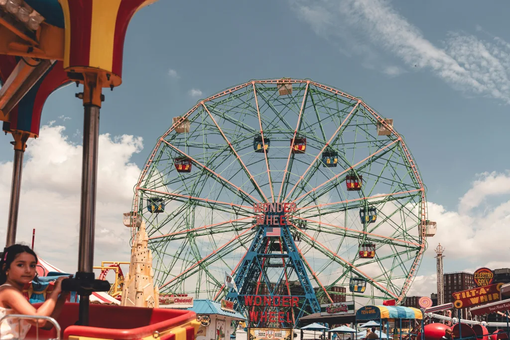 Photo by Kyle Miller: https://www.pexels.com/photo/a-ferris-wheel-is-in-the-middle-of-a-fair-27462440/