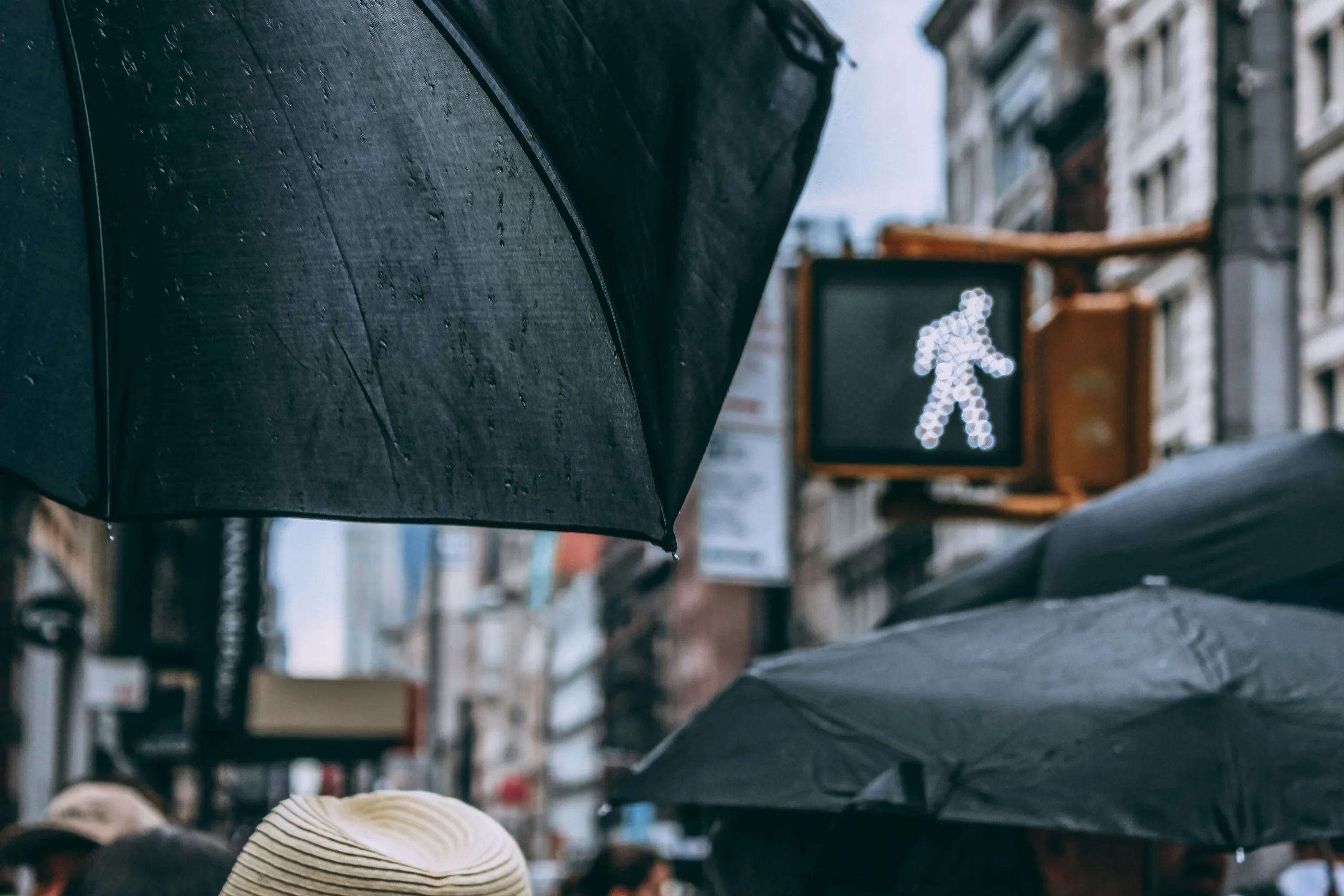 https://unsplash.com/photos/people-using-black-umbrellas-WTfByNYAIwo