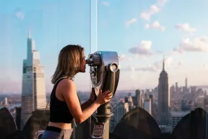 https://unsplash.com/photos/a-woman-looking-through-a-pair-of-binoculars-V_BVftBEGPc