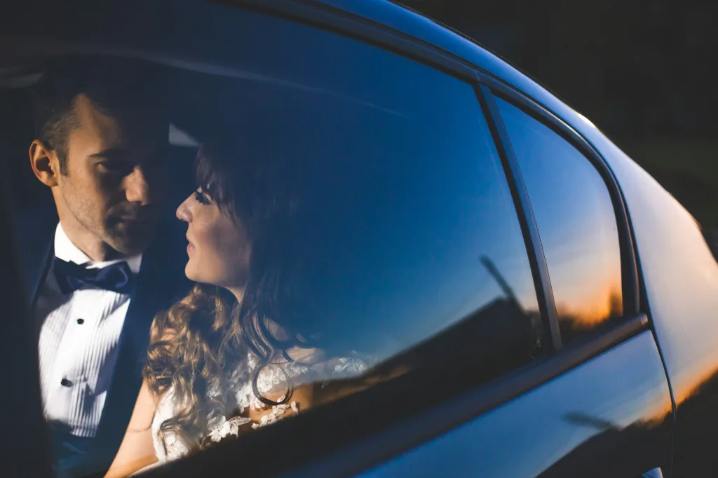 https://unsplash.com/photos/a-man-and-a-woman-in-a-car-okQERrxquws Photo by Marius Muresan on Unsplash