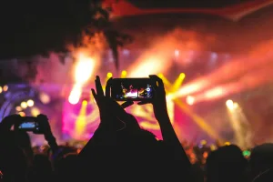 https://unsplash.com/photos/person-holding-smartphone-taking-video-of-a-concert-near-stage-with-lights-during-nighttime-JNuKyKXLh8U Photo by Noiseporn on Unsplash