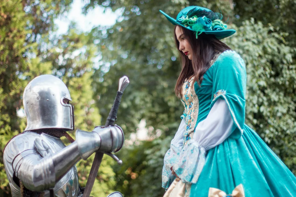https://www.pexels.com/photo/knight-in-front-of-woman-in-green-dress-1420462/