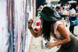 https://www.pexels.com/photo/photo-of-woman-painting-on-wall-1340502/