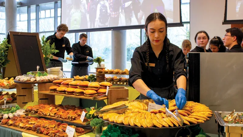 Event planning team coordinating catering and venue logistics