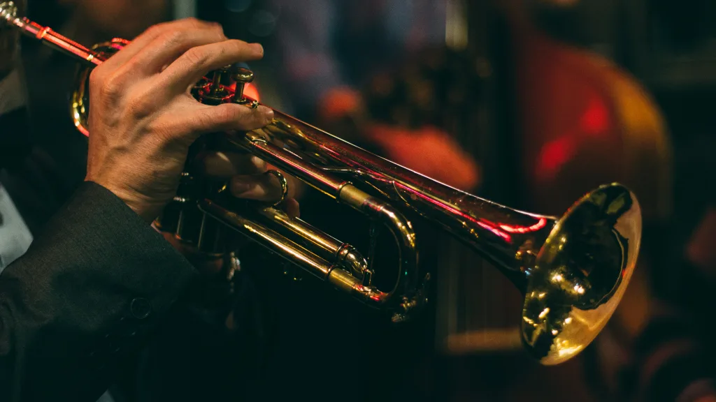 https://unsplash.com/photos/person-playing-trumpet-during-night-time-A10y2Eq7OHY Photo by Chris Bair on Unsplash