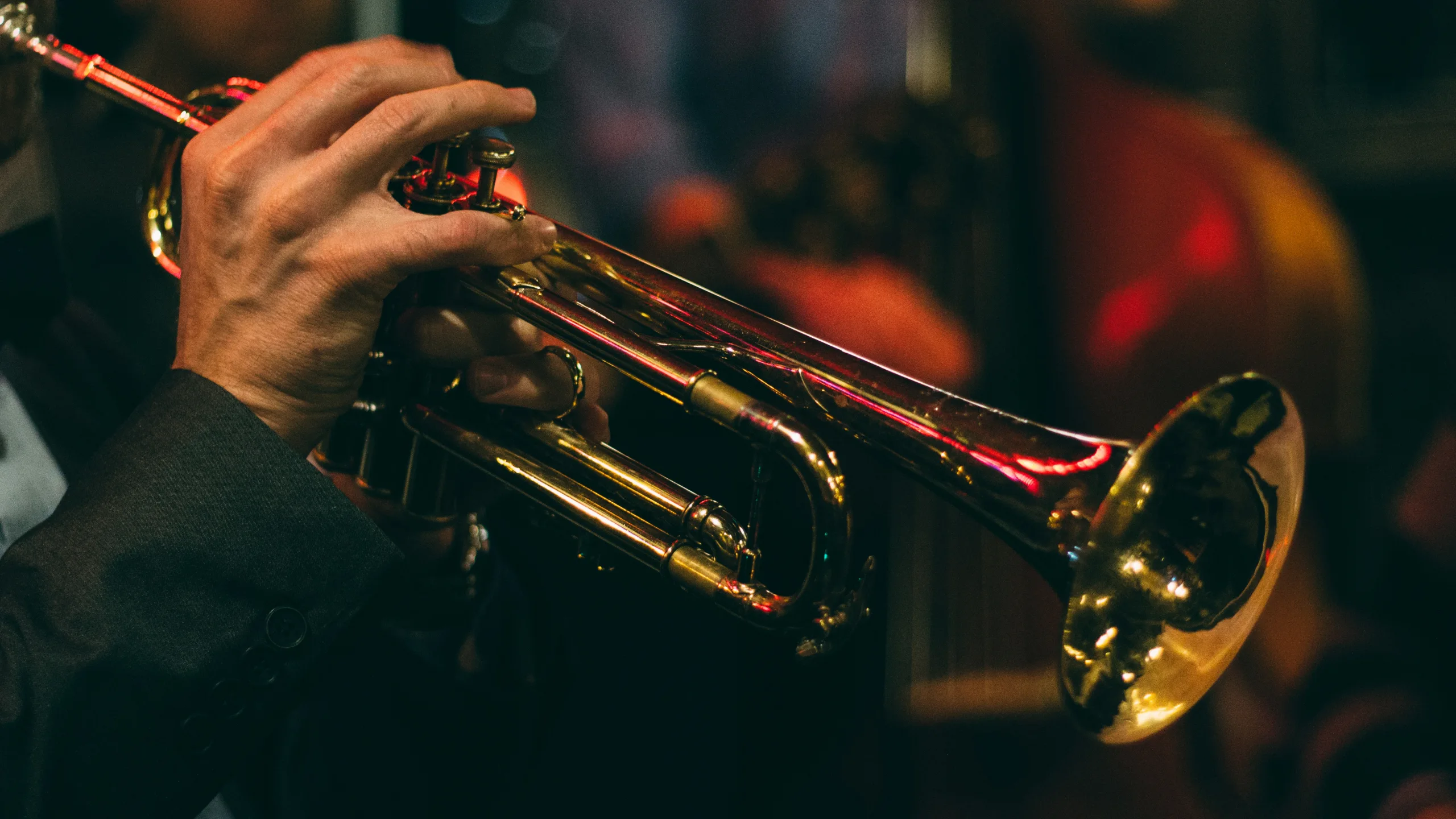 https://unsplash.com/photos/person-playing-trumpet-during-night-time-A10y2Eq7OHY Photo by Chris Bair on Unsplash