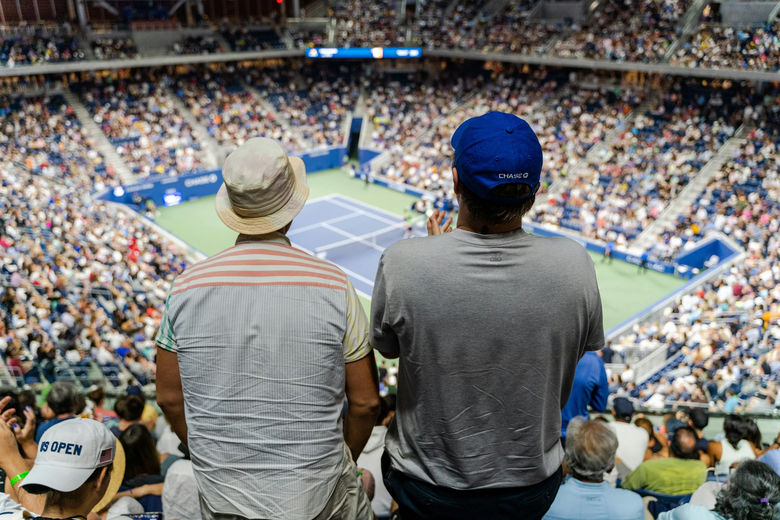 https://unsplash.com/photos/a-couple-of-men-in-a-stadium-kIVLl_SHKcM Photo by Dylan Freedom on Unsplash