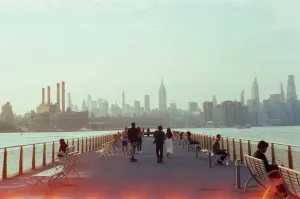https://unsplash.com/photos/people-stroll-on-pier-with-new-york-city-skyline-background-_IueletALhU