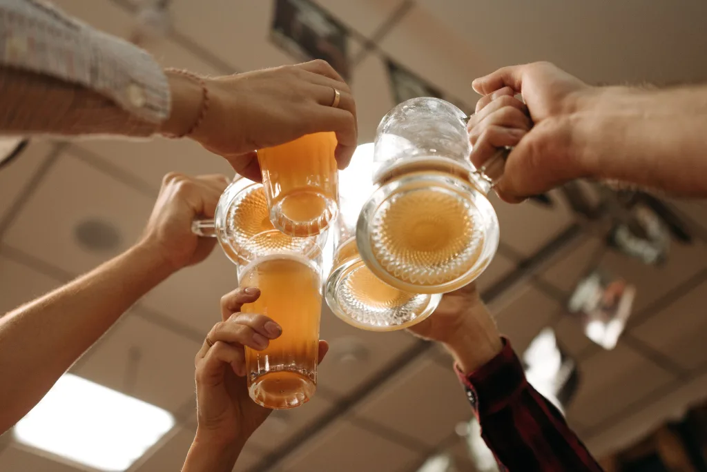 Photo by Pavel Danilyuk: https://www.pexels.com/photo/people-toasting-beer-glasses-5858191/