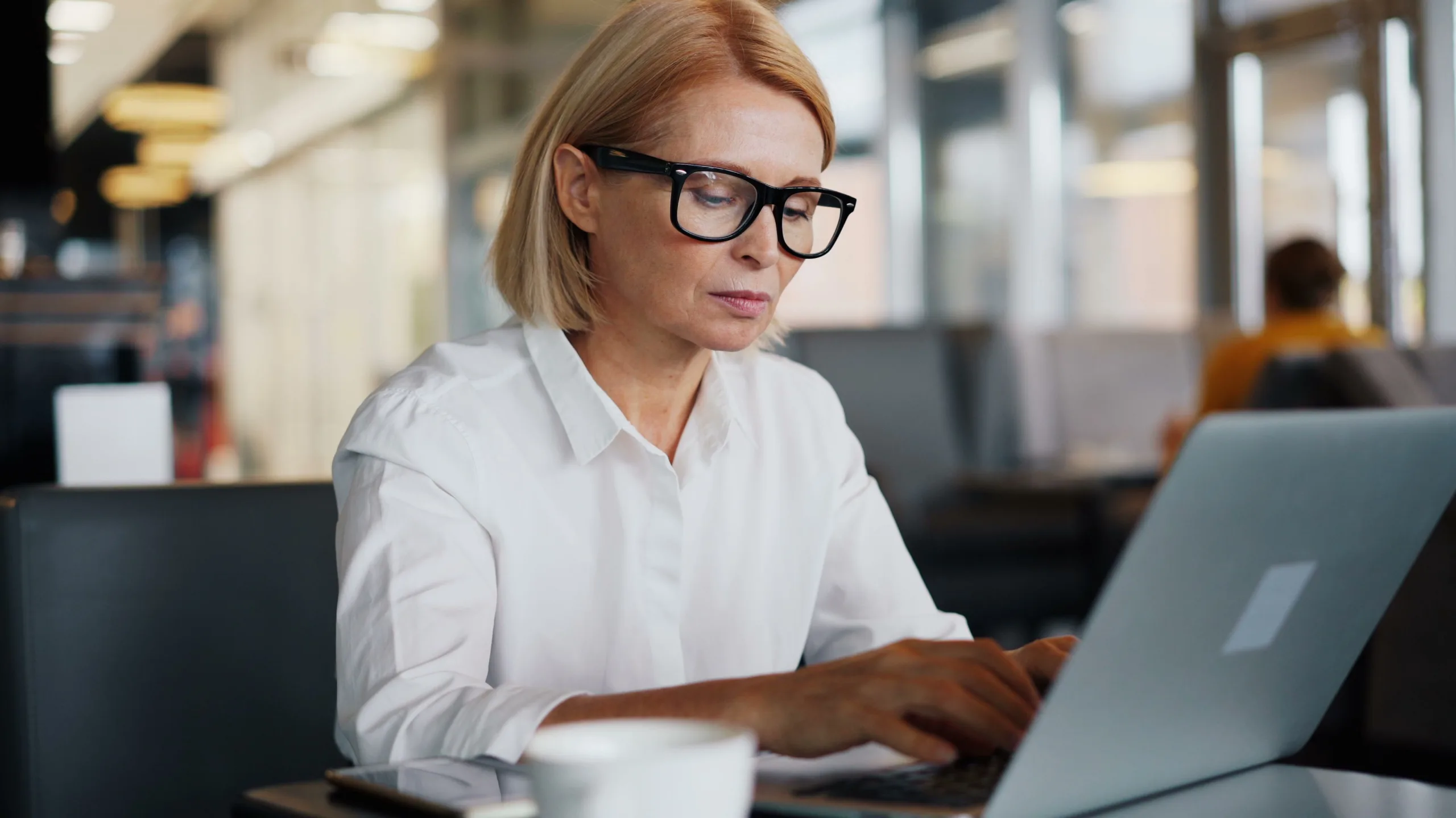 Photo by Vitaly Gariev: https://www.pexels.com/photo/a-woman-in-glasses-is-working-on-her-laptop-23496951/