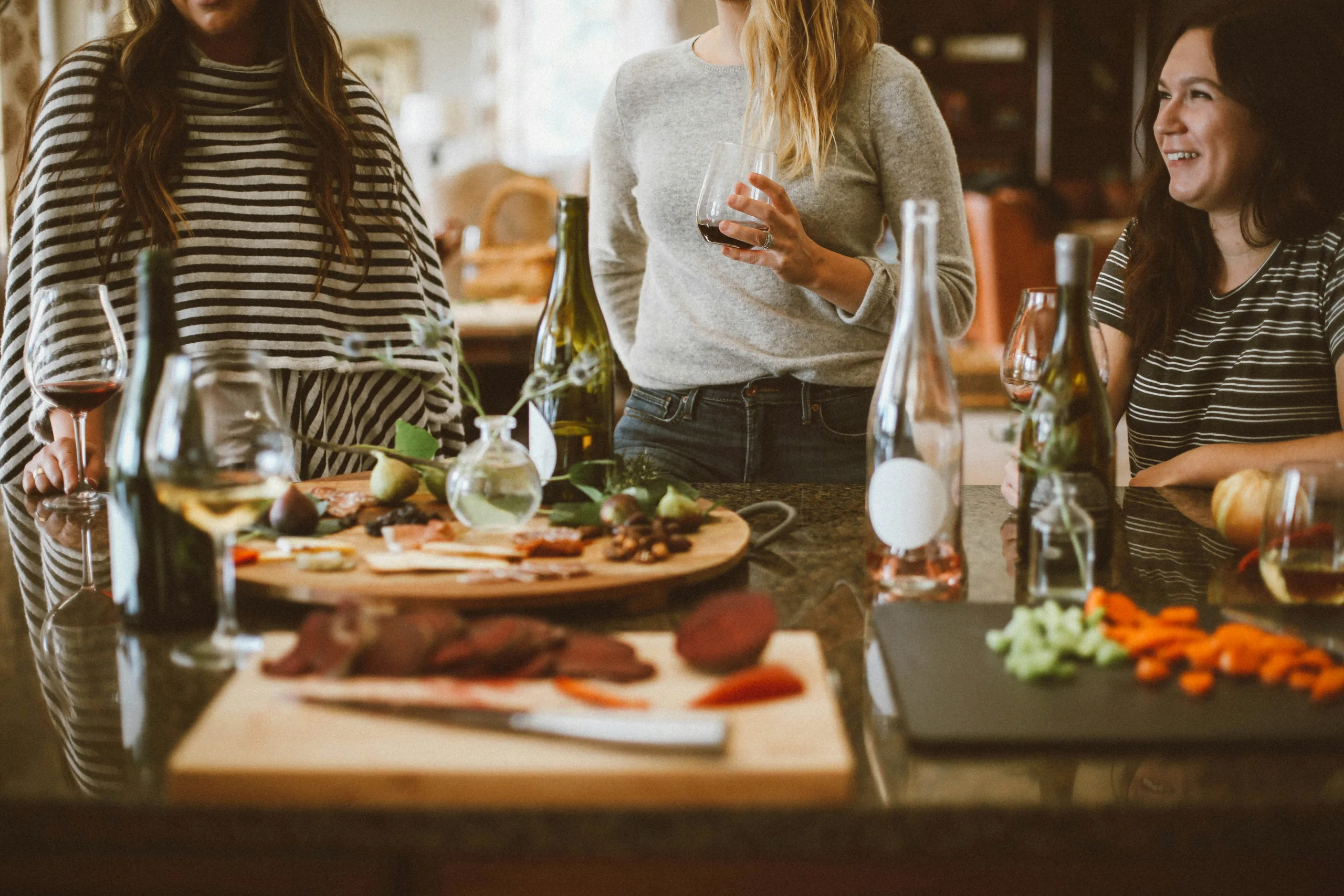 https://unsplash.com/photos/two-woman-standing-beside-woman-sitting-in-front-of-table-ZrhtQyGFG6s