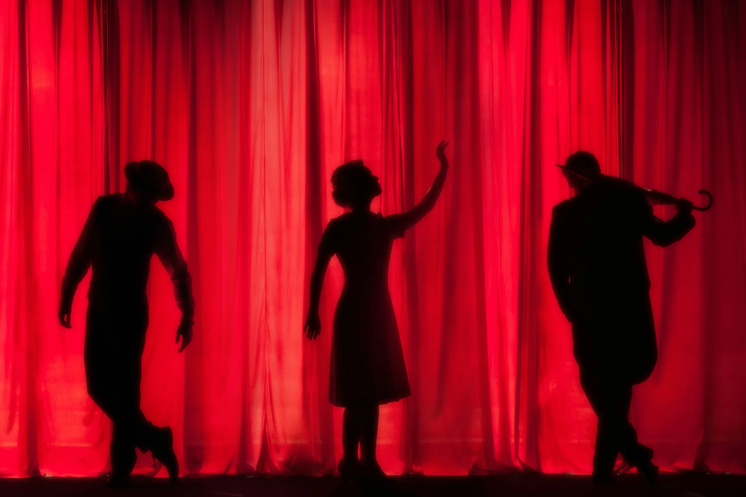 https://unsplash.com/photos/silhouette-of-three-performers-on-stage-p6rNTdAPbuk
