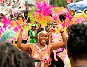 https://www.pexels.com/photo/people-in-colorful-costumes-on-the-street-at-a-parade-18396255/