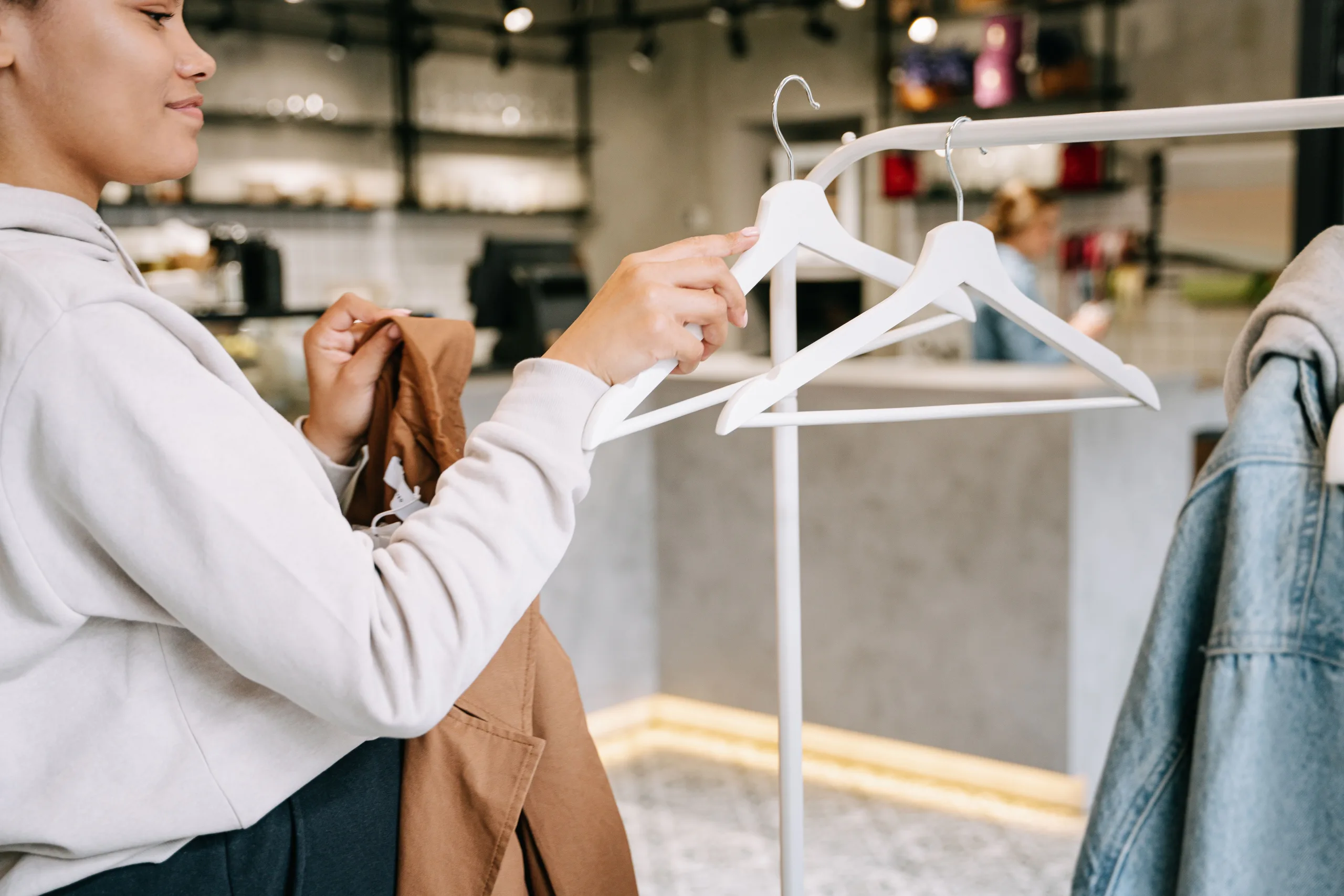 Photo by Ivan S: https://www.pexels.com/photo/a-woman-holding-a-hanger-7990513/
