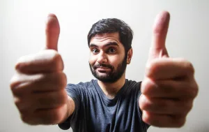 https://unsplash.com/photos/man-in-gray-crew-neck-shirt-making-thumbs-up--AQ-P_R25aI