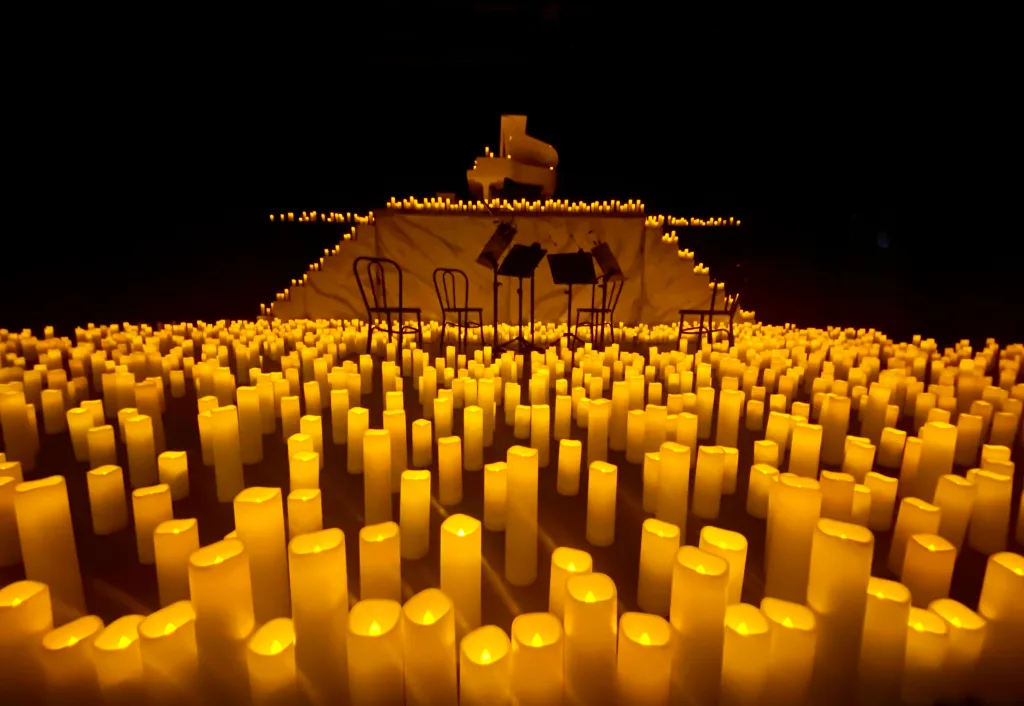 https://www.pexels.com/photo/stage-full-of-candles-13084352/